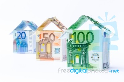 Three Houses Made Of Bank Notes Stock Photo