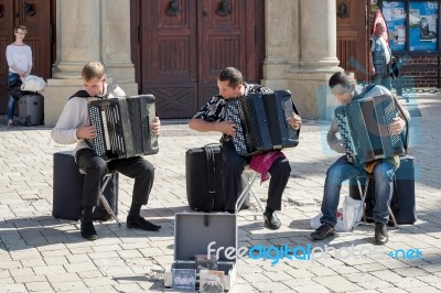 Three Men Playing Accordians In Krakow Stock Photo