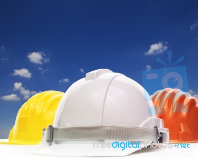 Three Of Safety Helmet Construction Protection On White Against Stock Photo