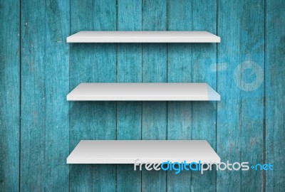 Three White Shelves On Blue Wooden Interior Texture Background Stock Photo