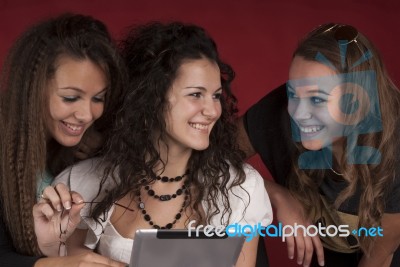 Three Young Girls With Tablet Pc Stock Photo