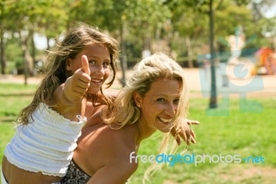 Thumb Up Child On Piggyback Ride Stock Photo