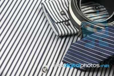 Tie And Belt On Striped Shirt Background Stock Photo