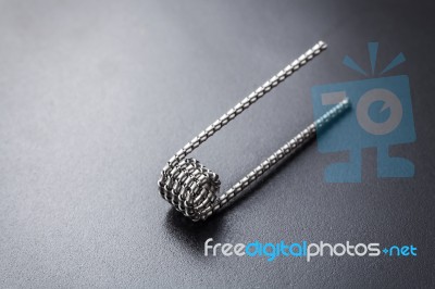 Tiger Coil For Vaping On A Black Background Stock Photo