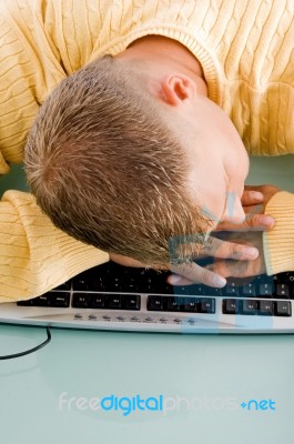 Tired Man Sleeping On Keyboard Stock Photo