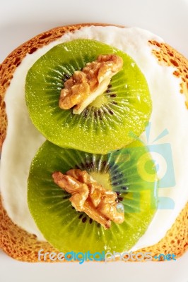 Toast With Kiwi, Cheese And Walnuts Stock Photo