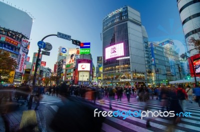 Tokyo - November 28, 2013: Pedestrians At The Famed Crossing Of Stock Photo