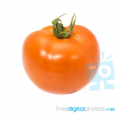 Tomato With Green Stem On White Background Stock Photo