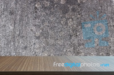 Top Of Wood Table On Old Concrete Wall Background Stock Photo