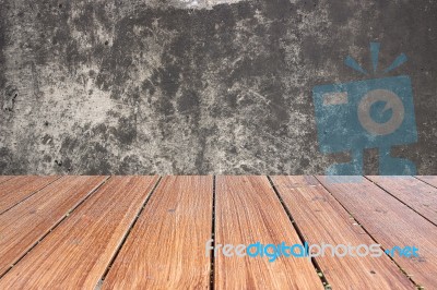 Top Of Wood Table On Old Concrete Wall Background Stock Photo