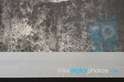 Top Of Wood Table On Old Concrete Wall Background Stock Photo