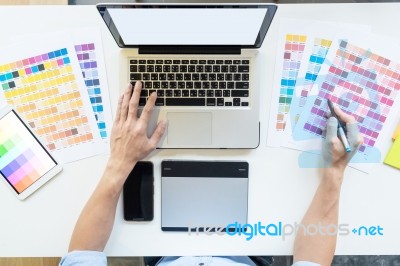 Top View Of A Young Graphic Designer Working On A Desktop Comput… Stock Photo