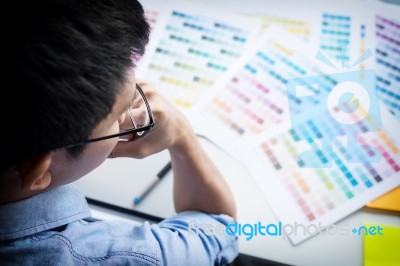 Top View Of A Young Graphic Designer Working On A Desktop Comput… Stock Photo