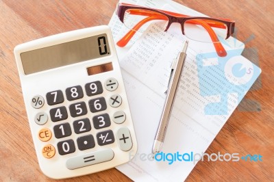 Top View Of Calculator, Pen, Eyeglasses And Bank Account Passboo… Stock Photo