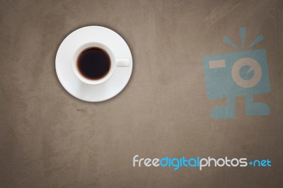 Top View Of Coffee Cup On Gray Concrete Background Stock Photo