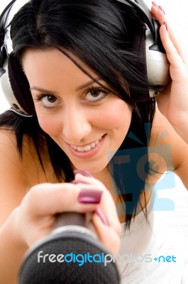 Top View Of Female With Headphone And Microphone With White Background Stock Photo