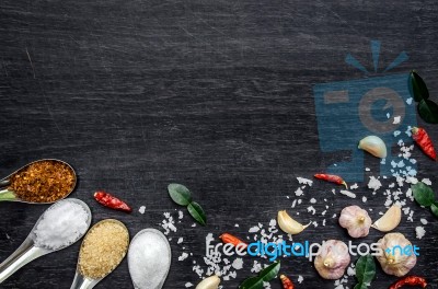 Top View Of Food Ingredients And Condiment On The Table, Ingredients And Seasoning On Dark Wooden Floor Stock Photo