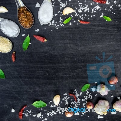 Top View Of Food Ingredients And Condiment On The Table, Ingredients And Seasoning On Dark Wooden Floor Stock Photo