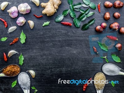 Top View Of Food Ingredients And Condiment On The Table, Ingredients And Seasoning On Dark Wooden Floor Stock Photo