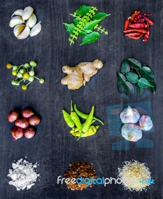 Top View Of Food Ingredients And Condiment On The Table, Ingredients And Seasoning On Dark Wooden Floor Stock Photo