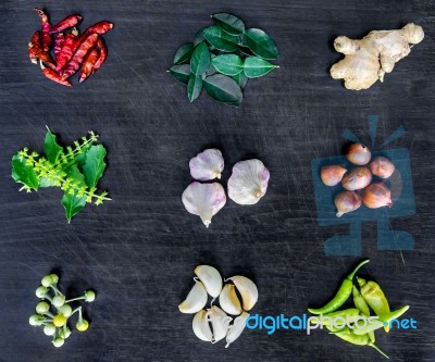 Top View Of Food Ingredients And Condiment On The Table, Ingredients And Seasoning On Dark Wooden Floor Stock Photo