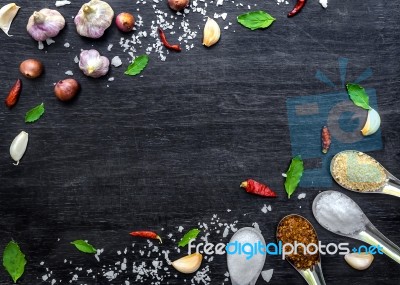 Top View Of Food Ingredients And Condiment On The Table, Ingredients And Seasoning On Dark Wooden Floor Stock Photo