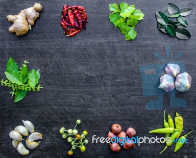 Top View Of Food Ingredients And Condiment On The Table, Ingredients And Seasoning On Dark Wooden Floor Stock Photo