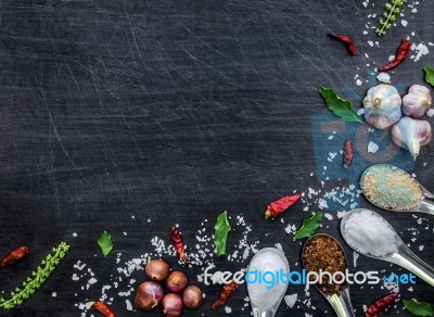 Top View Of Food Ingredients And Condiment On The Table, Ingredients And Seasoning On Dark Wooden Floor Stock Photo