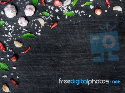 Top View Of Food Ingredients And Condiment On The Table, Ingredients And Seasoning On Dark Wooden Floor Stock Photo