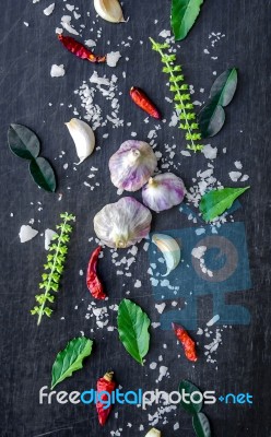 Top View Of Food Ingredients And Condiment On The Table, Ingredients And Seasoning On Dark Wooden Floor Stock Photo