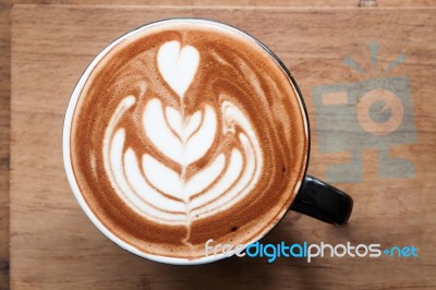 Top View Of Hot Coffee On Wooden Table Stock Photo