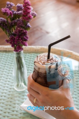 Top View Of Iced Chocolate On Glass Table Stock Photo