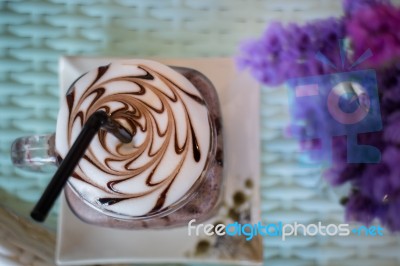 Top View Of Iced Chocolate On Glass Table Stock Photo