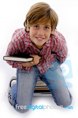 Top View Of Little Boy Holding Book Stock Photo