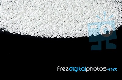 Top View Of Rice Seed On The Black Background For Isolated Stock Photo