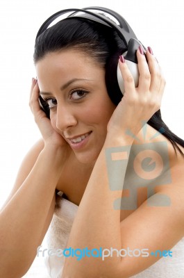 Top View Of Smiling Female Wearing Headphone Stock Photo