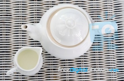 Top View Of Teapot With Little Milk Jar Stock Photo