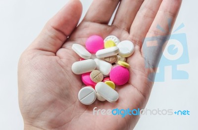 Top View Of The Pills On The Hand And White Background, A Hand Hold The Pills And Drug Stock Photo