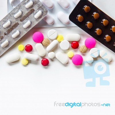 Top View Of The Pills On The White Background, Pack Of Tablet Drug And Capsule Pills On The Floor Stock Photo