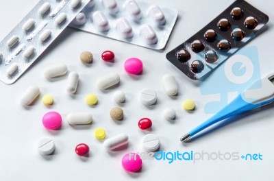 Top View Of The Pills On The White Background, Pack Of Tablet Drug And Capsule Pills On The Floor Stock Photo