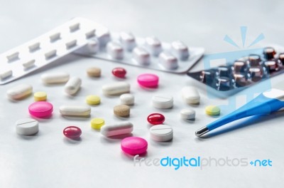 Top View Of The Pills On The White Background, Pack Of Tablet Drug And Capsule Pills On The Floor Stock Photo