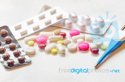 Top View Of The Pills On The White Background, Pack Of Tablet Drug And Capsule Pills On The Floor Stock Photo