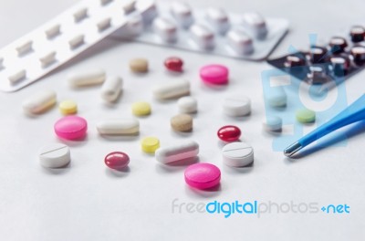 Top View Of The Pills On The White Background, Pack Of Tablet Drug And Capsule Pills On The Floor Stock Photo