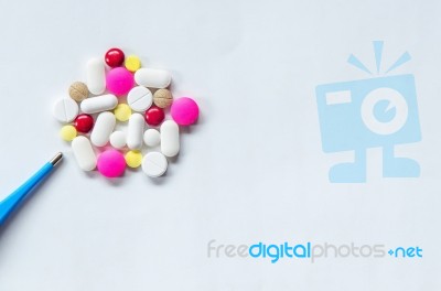 Top View Of The Pills On The White Background, The Drug And Capsule Pills On The Floor Stock Photo