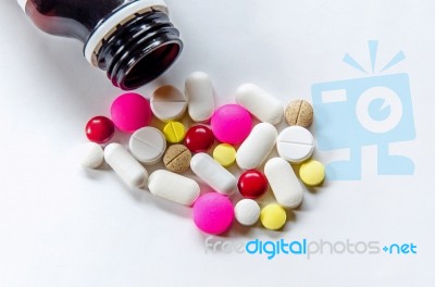 Top View Of The Pills On The White Background, The Drug And Capsule Pills On The Floor Stock Photo