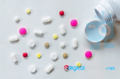 Top View Of The Pills On The White Background, The Drug And Capsule Pills On The Floor Stock Photo