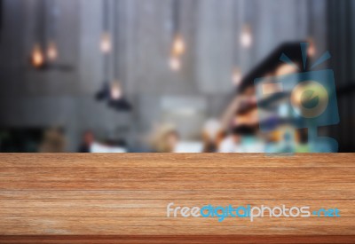 Top Wooden Table With Blurred Cafe Background Stock Photo