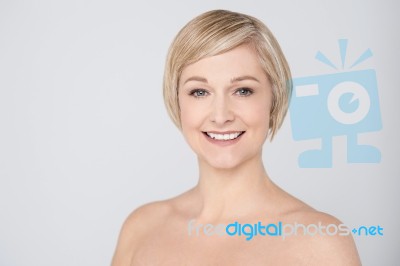 Topless Woman Smiling Over Grey Stock Photo