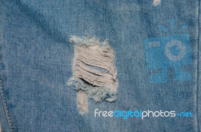 Torn Jeans Stock Photo