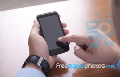 Touch The Screen On The Smart Phone Stock Photo